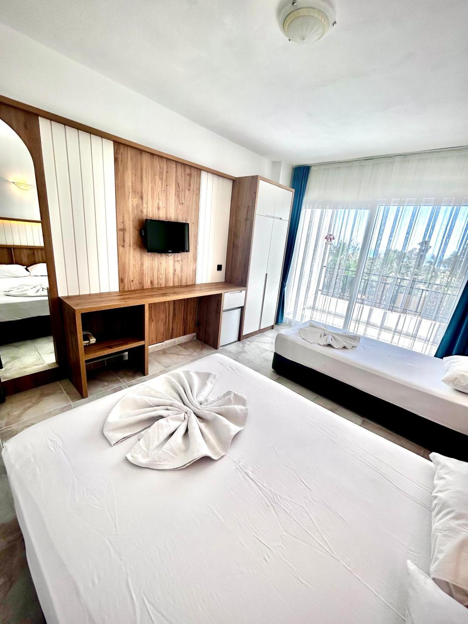 Tunan Motel Айвалык Номер фото