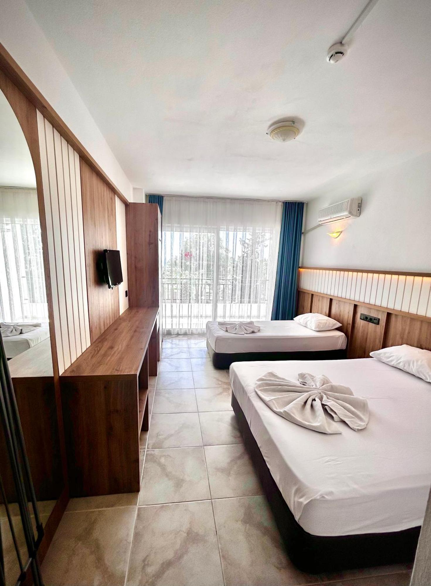 Tunan Motel Айвалык Номер фото