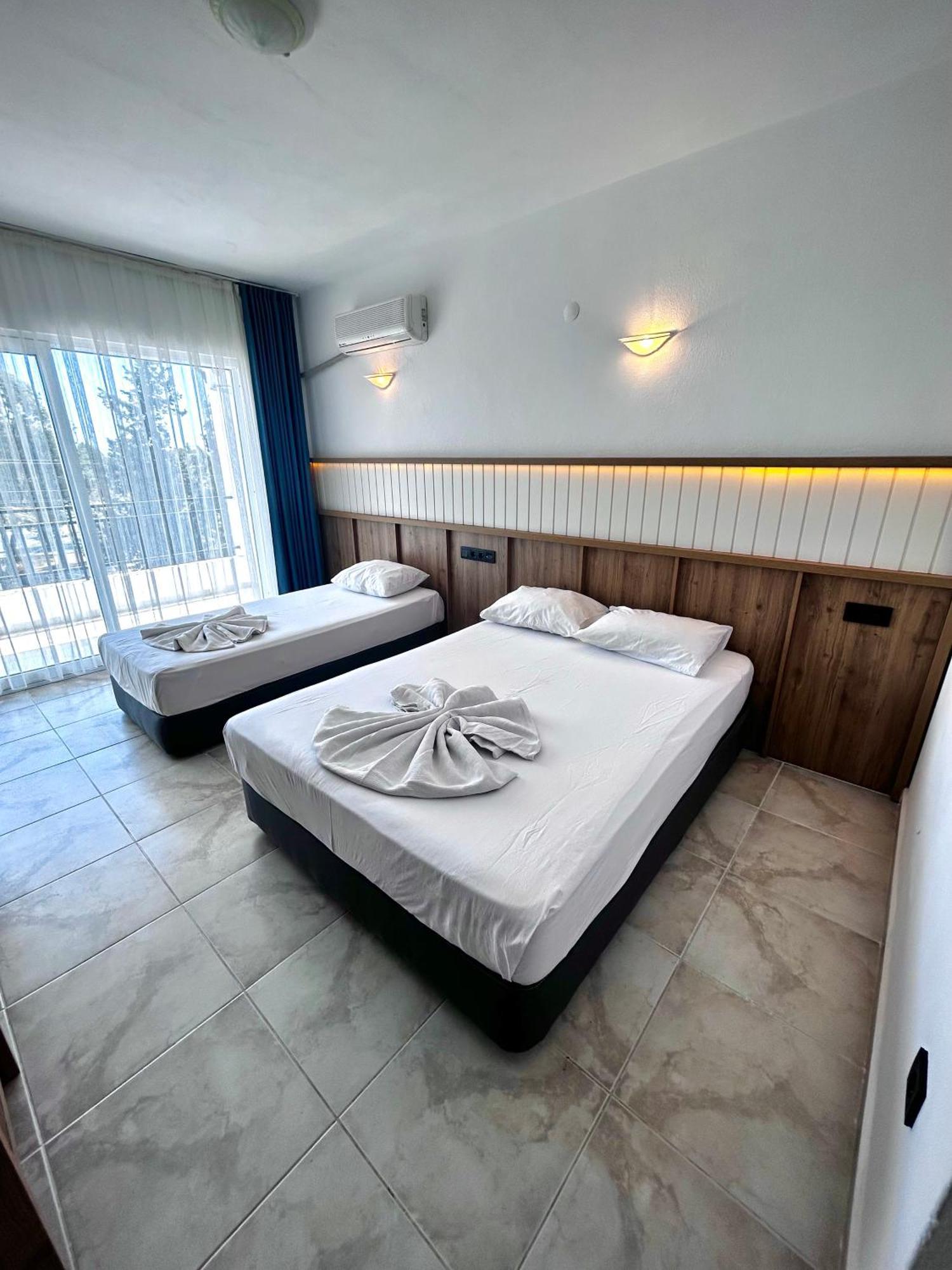 Tunan Motel Айвалык Номер фото